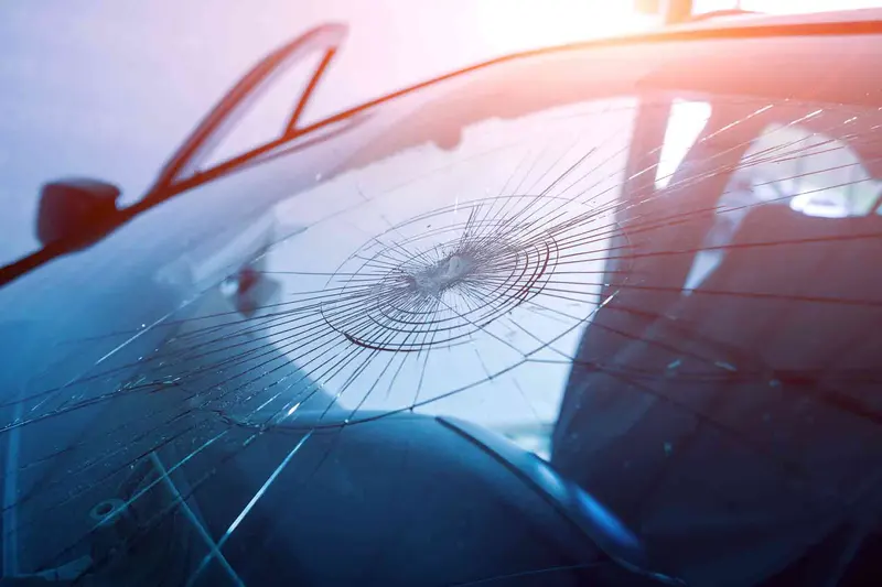 Close view of a stone chip in a windscreen